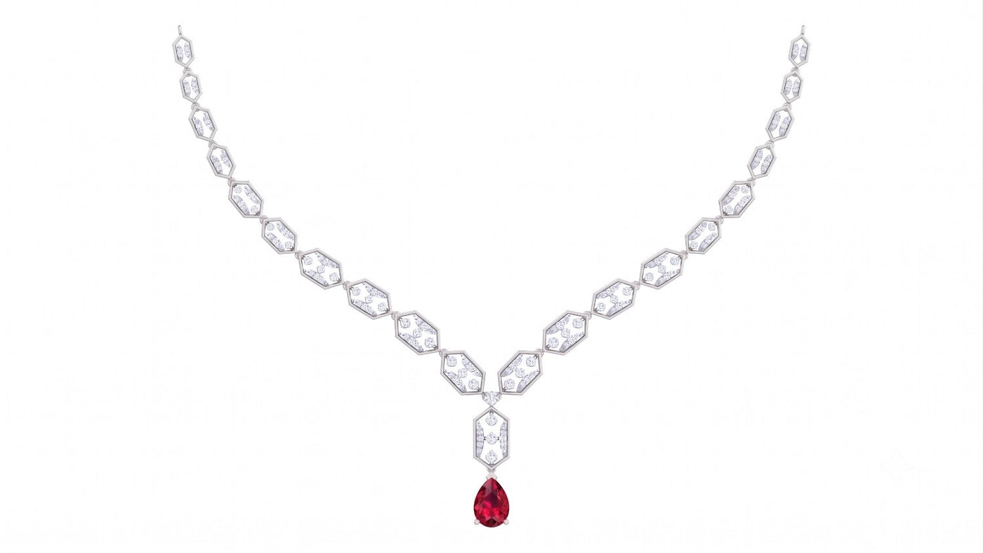 A white gold Y-shaped necklace featuring a gemstones and a teardrop-shaped red ruby, displayed on a solid white background.