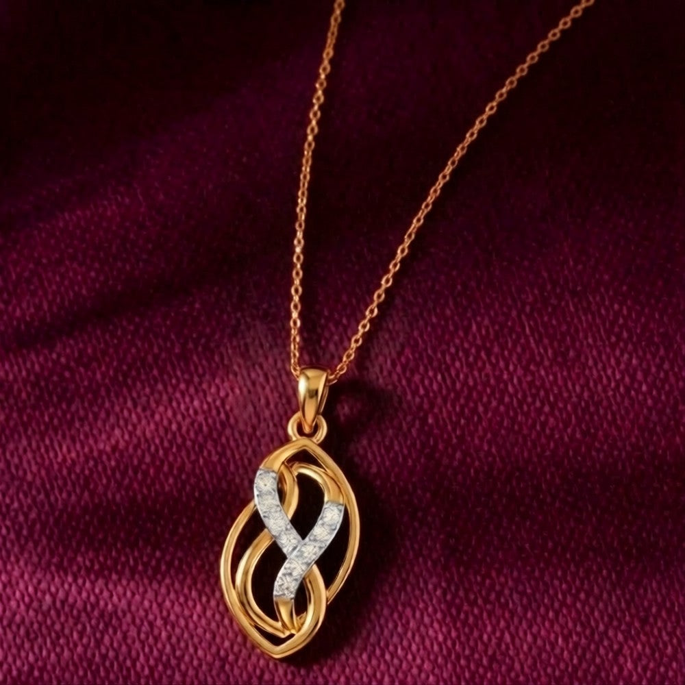 Gold and diamond with a intricate pendant on a purple fabric background