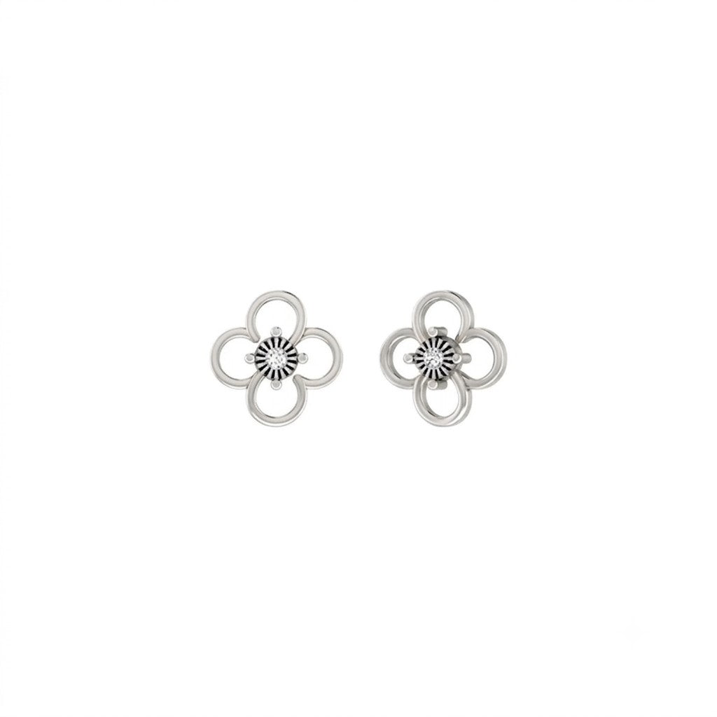 White gold and diamond floral earrings on a white background.