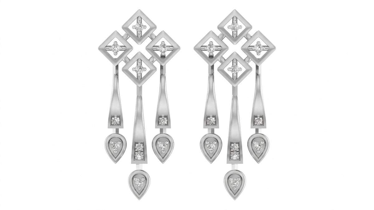 White gold and diamond chandelier earrings on a white background