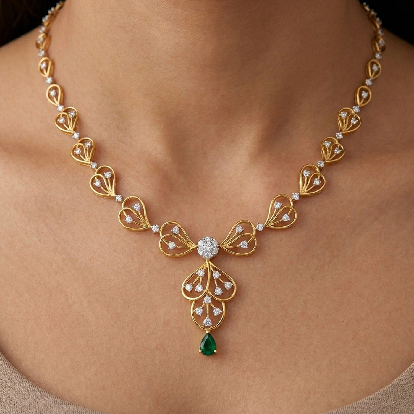 A close-up of a gold and diamond necklace worn on a model's neck.