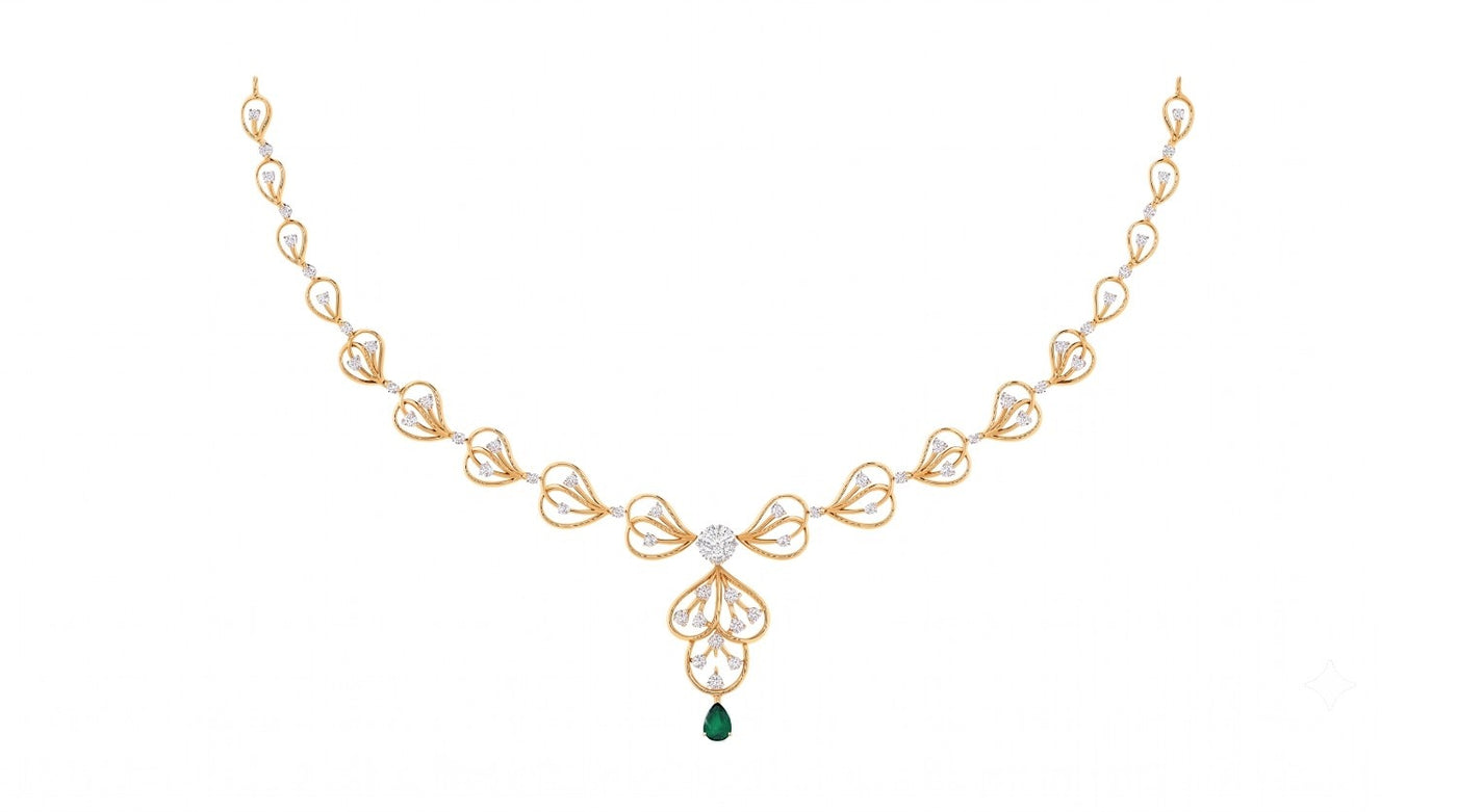 A yellow gold and diamond necklace featuring a green teardrop gemstone, shown on a plain white background.