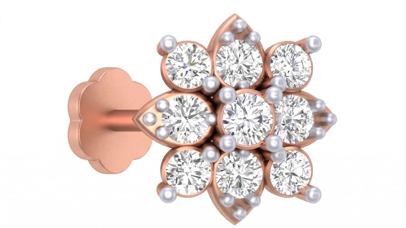 Rose gold and diamond stud and nosepin-like stones on a white background