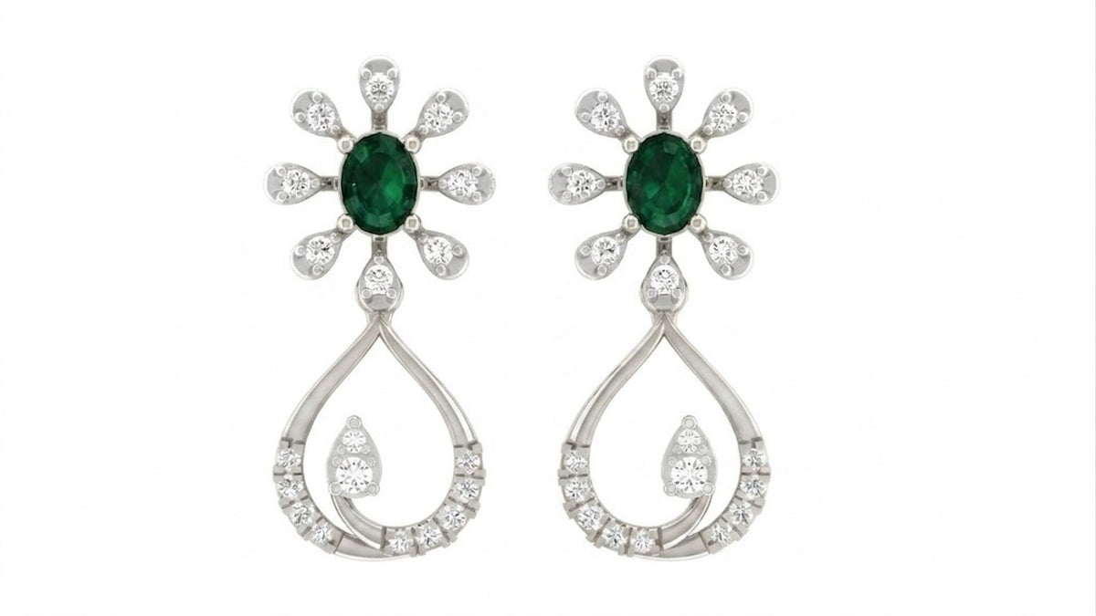 White gold and diamond drop earring with gemstone on a white background.