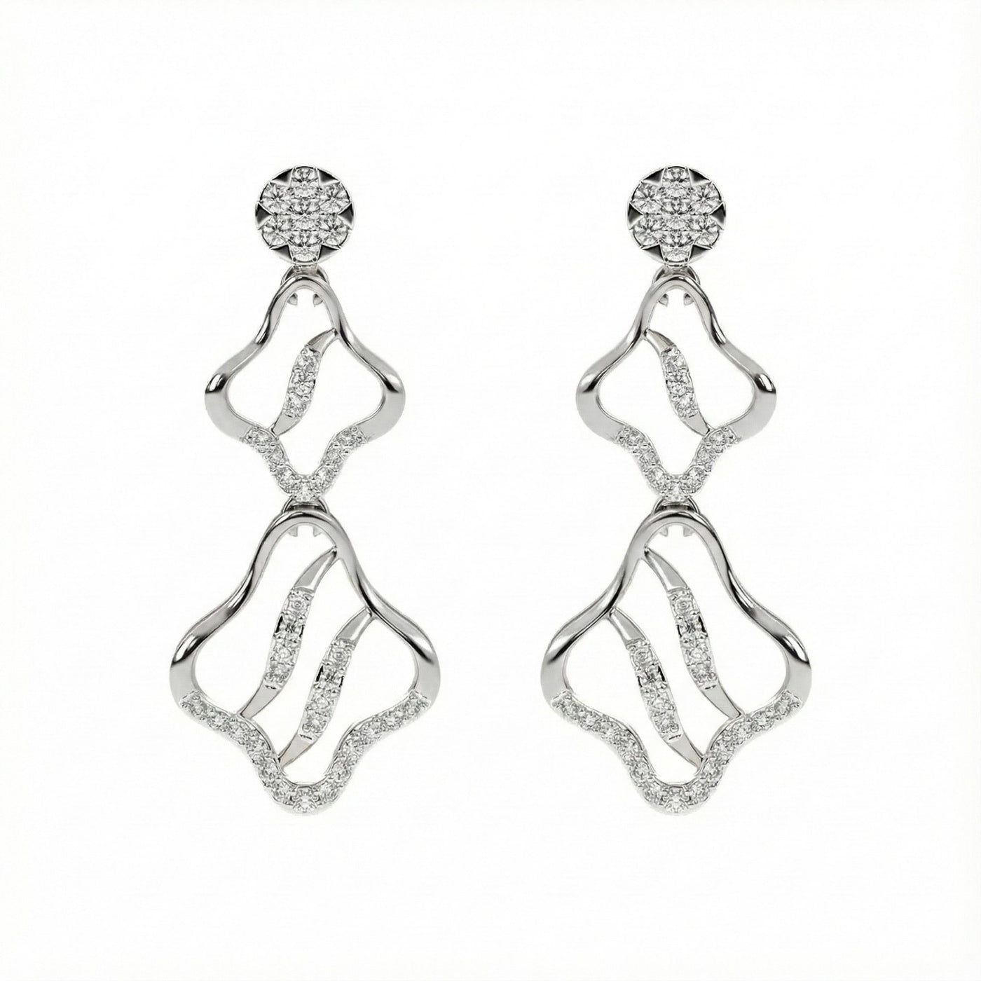 A pair of white gold earrings with diamond accents, featuring an elegant, intricate design.