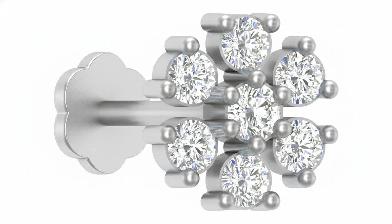 A white gold and diamond stud nose pin featuring a floral cluster design with round brilliant-cut clear stones and small white pearls, shown on a plain white background.