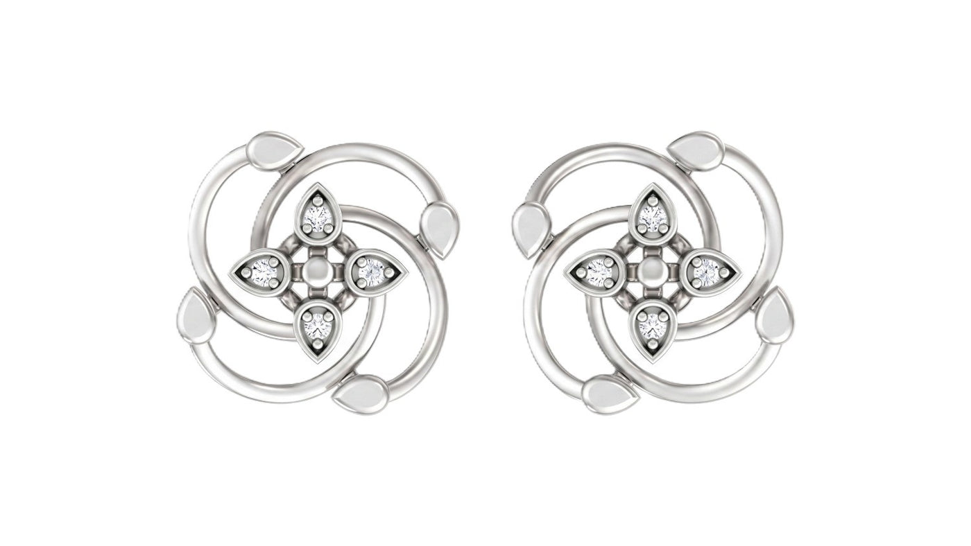 White gold and diamond earrings with floral design on a white background.