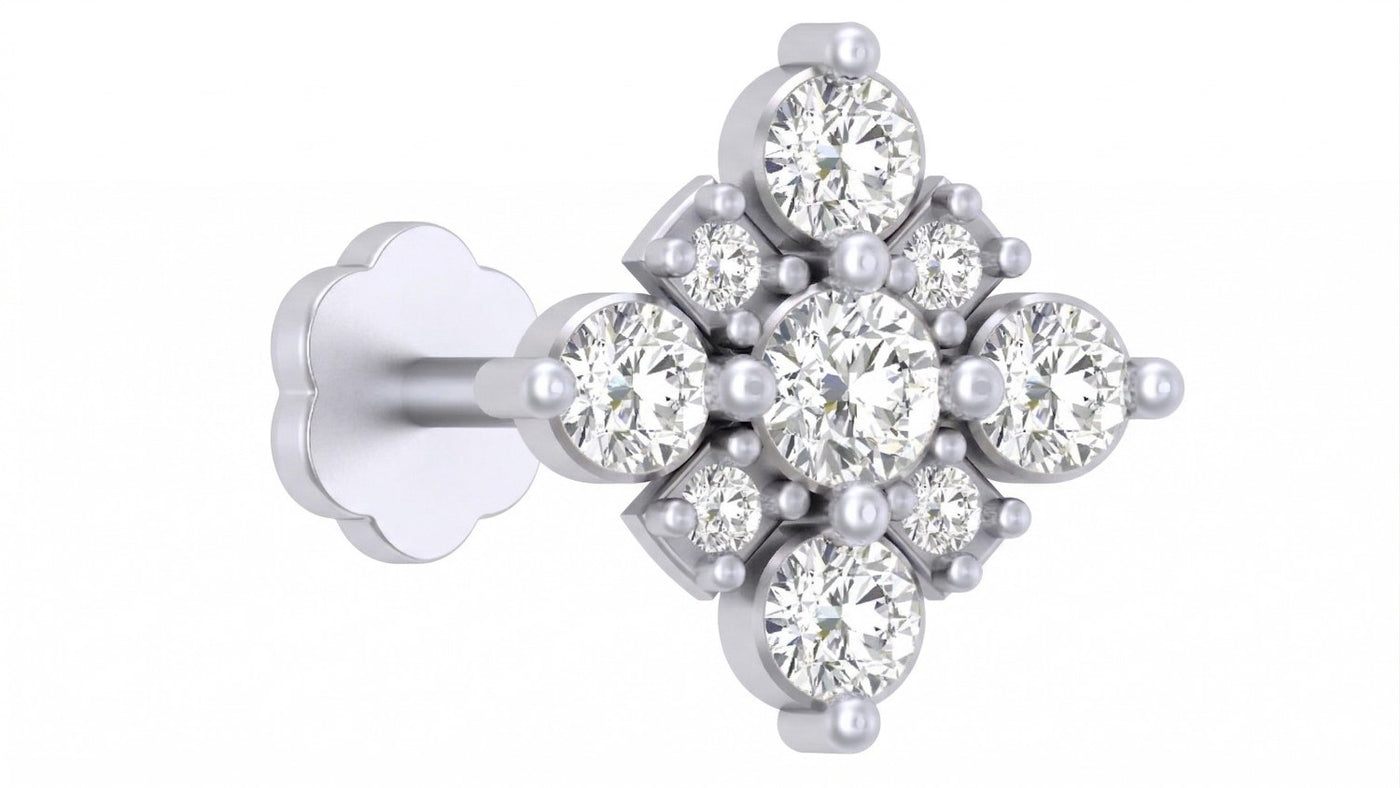 white gold and diamond stud nose pin on a white background