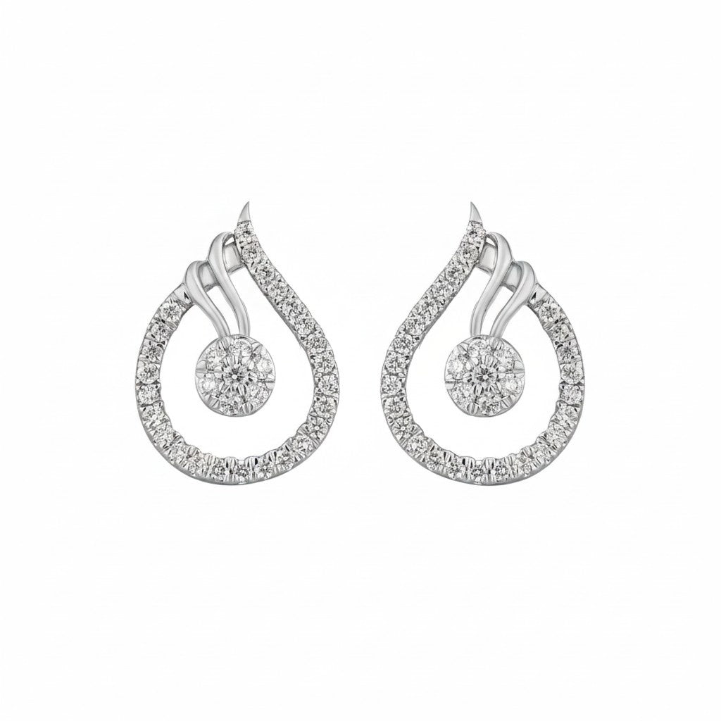 A pair of white gold teardrop-shaped earrings featuring a silver-toned outer halo paved with small clear stones