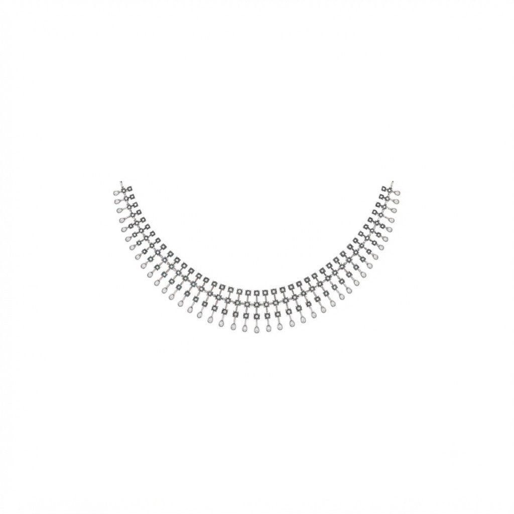 A white gold and diamond necklace with teardrop design, displayed on a plain white background.