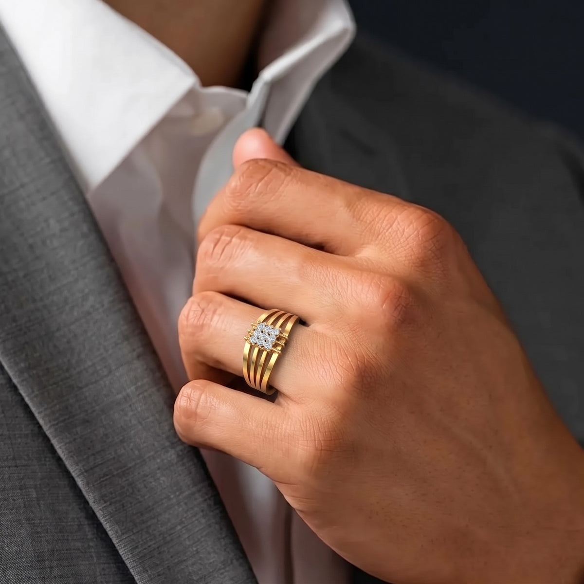 Gold ring with a diamond on a person finger.