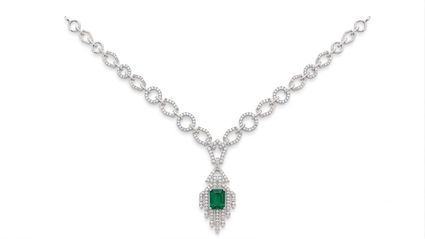 A white gold and diamond necklace featuring a central emerald-cut green gemstone, displayed on a clean white background.
