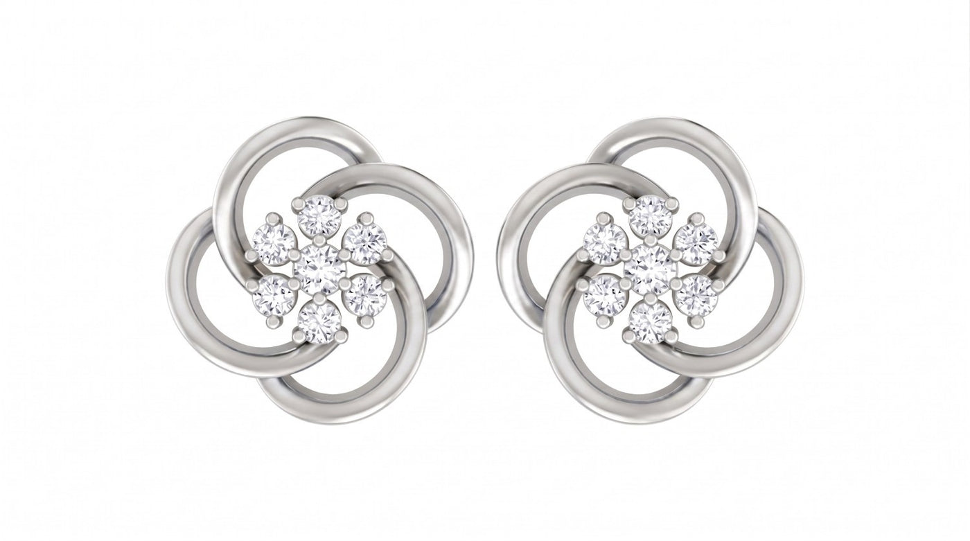 White gold and diamond floral stud  earrings on a white background