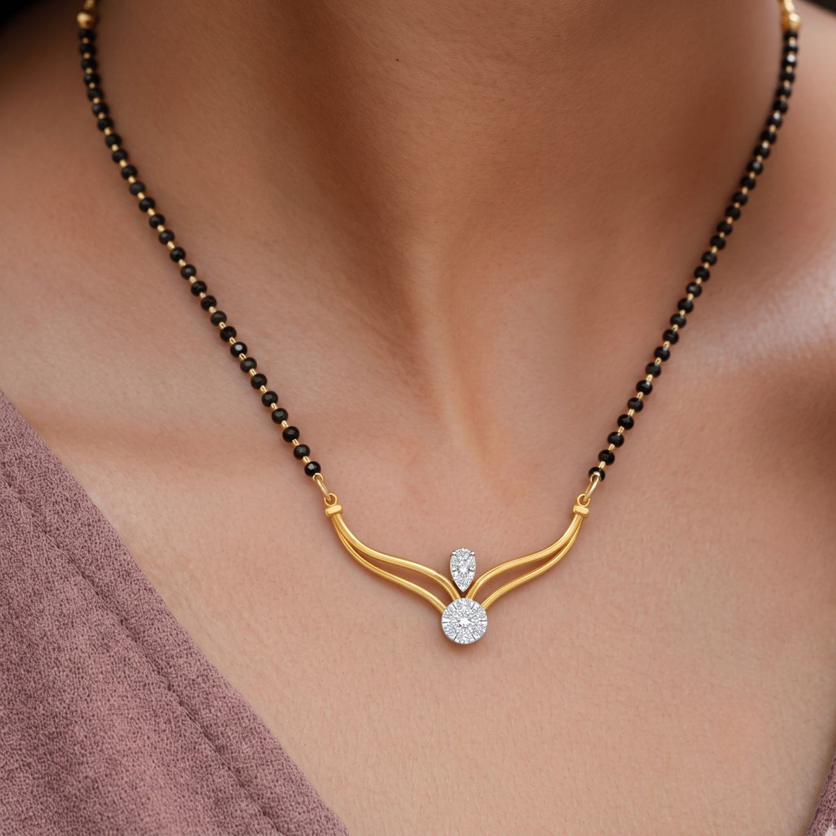 Women wearing yellow gold and diamond mangalsutra 