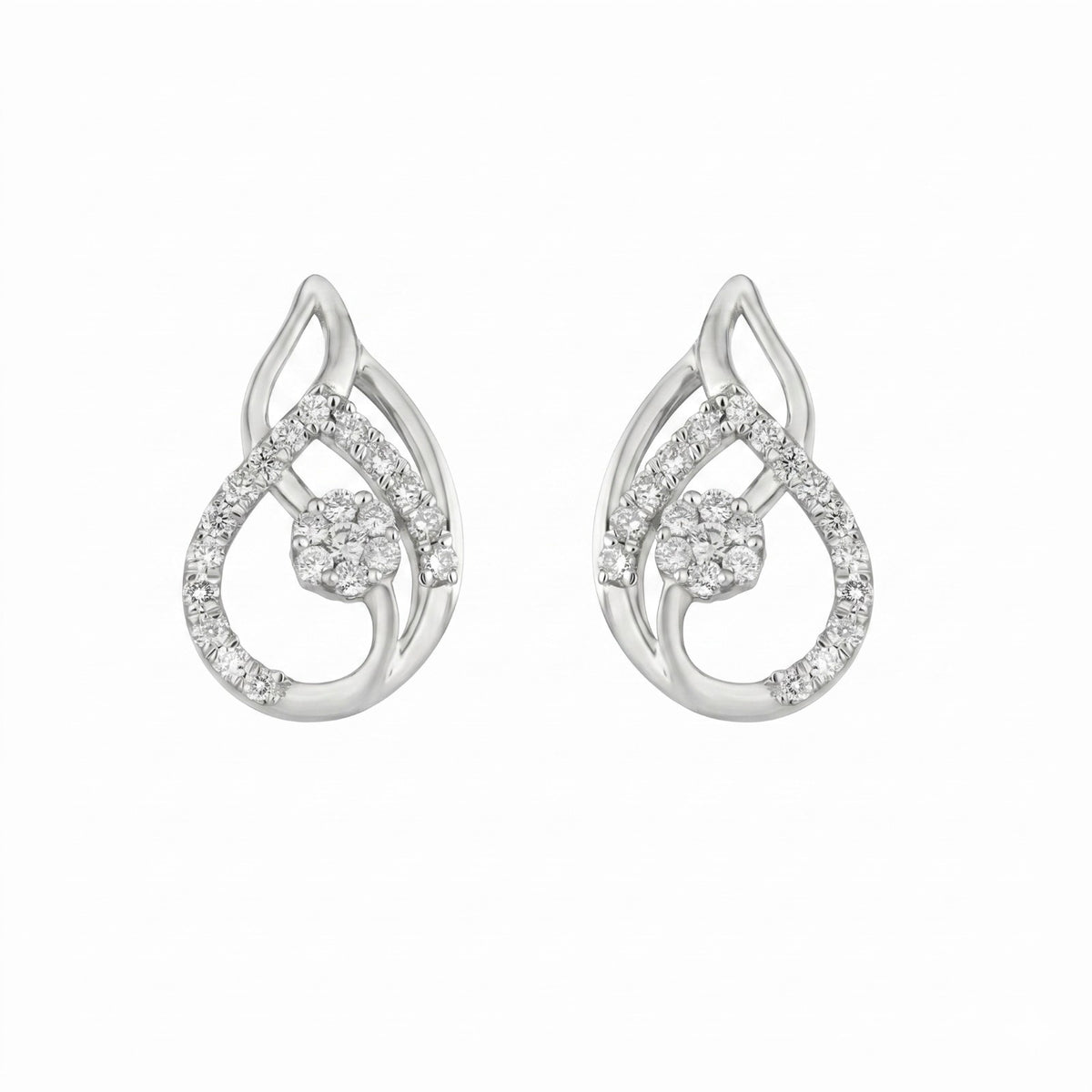 White gold and diamond earrings on a white background.