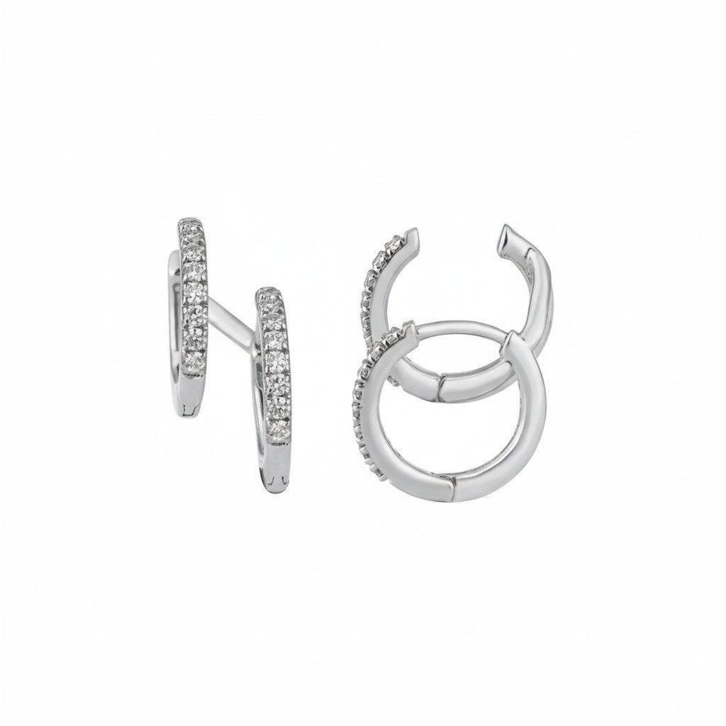 White gold hoop earrings with embedded stones on a white background.