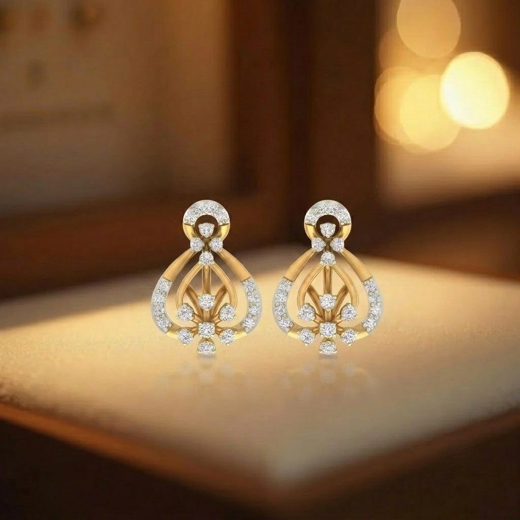 A pair of gold and diamond earrings displayed against a warm, blurred background.