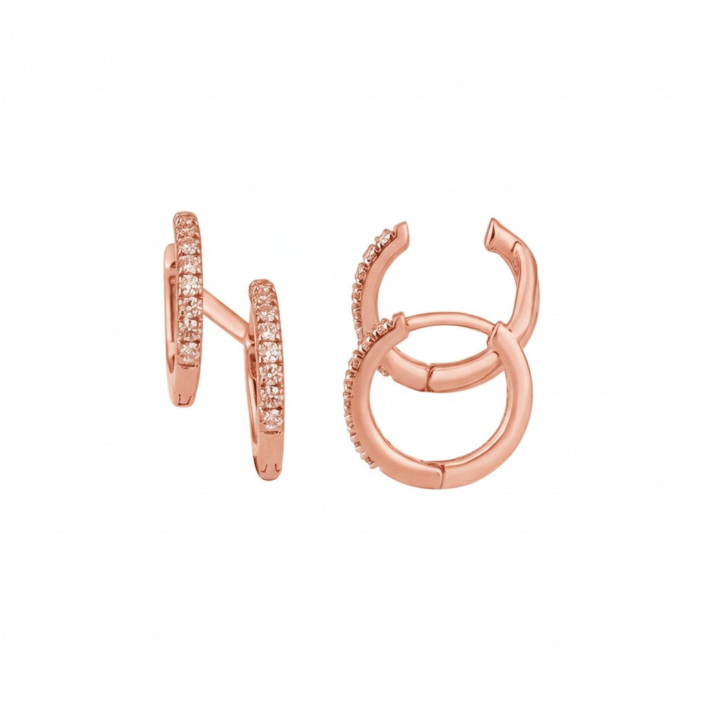 Rose gold hoop earrings with embedded stones on a white background