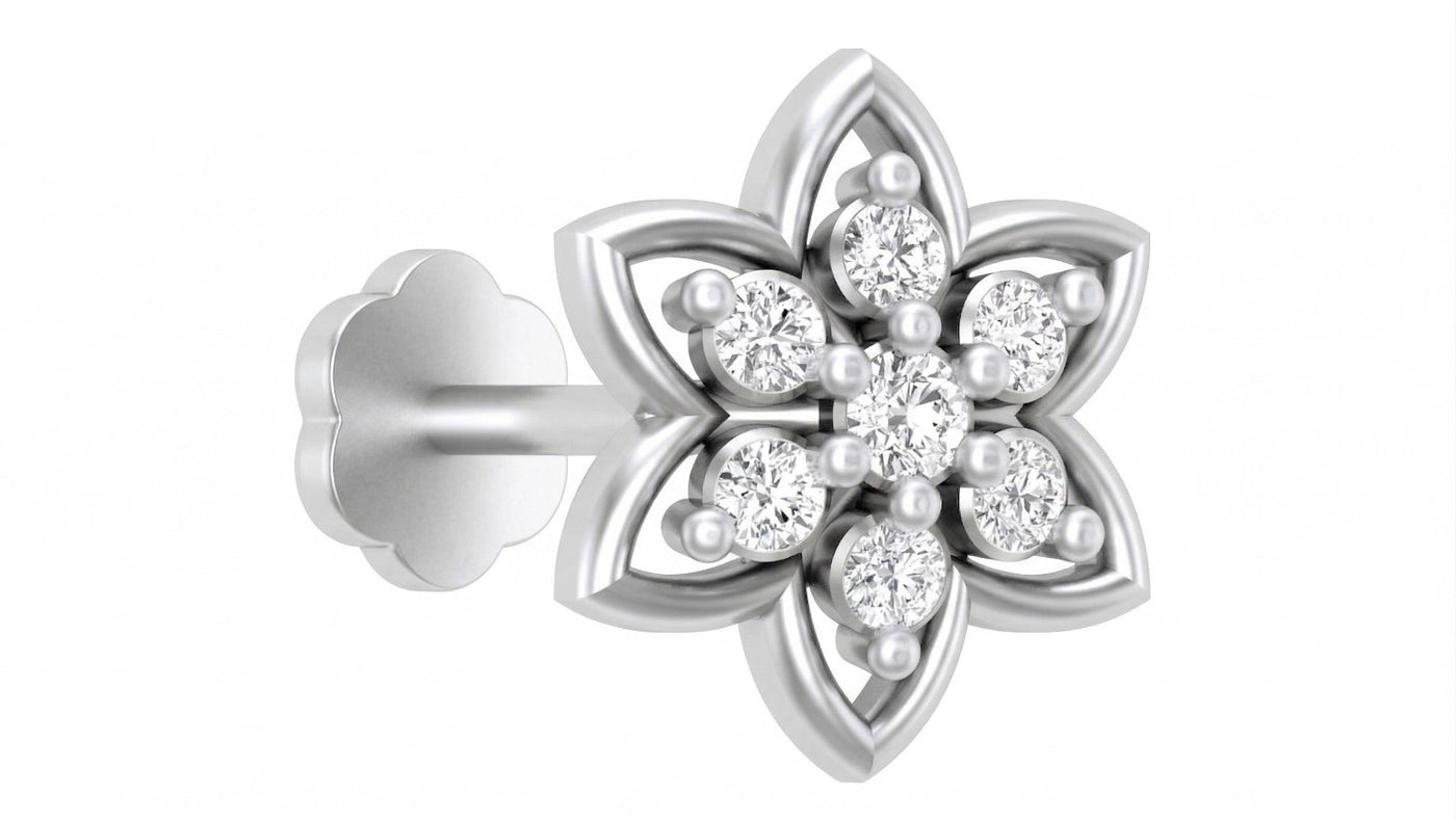 white gold and diamond stud nose pin on a white surface