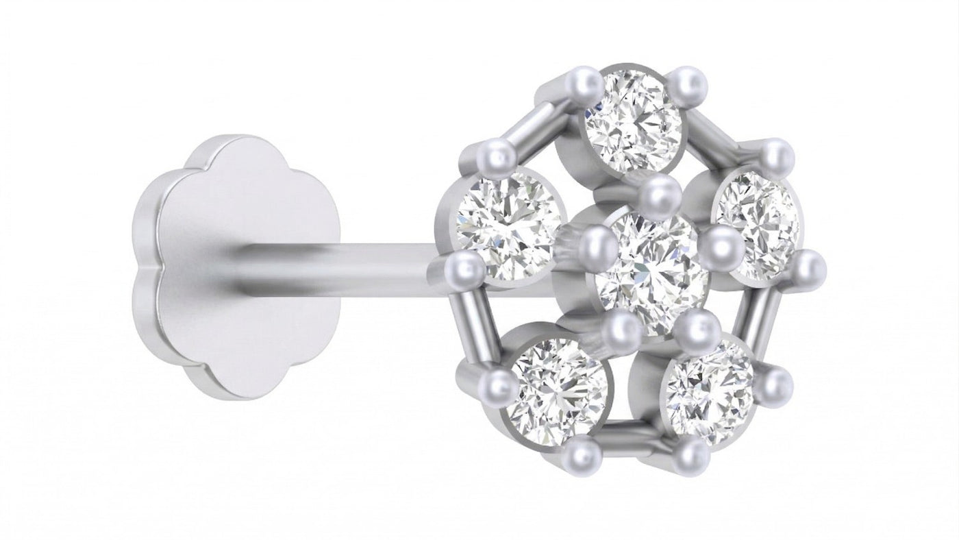 A white gold and diamond stud nose pin, featuring seven round-cut clear gemstones arranged in a geometric pattern, shown on a plain white background.