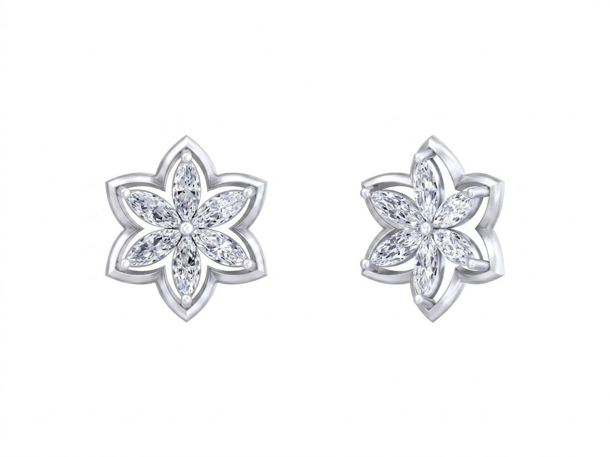 Pair of white gold and diamond floral-shaped stud earrings on a white background.