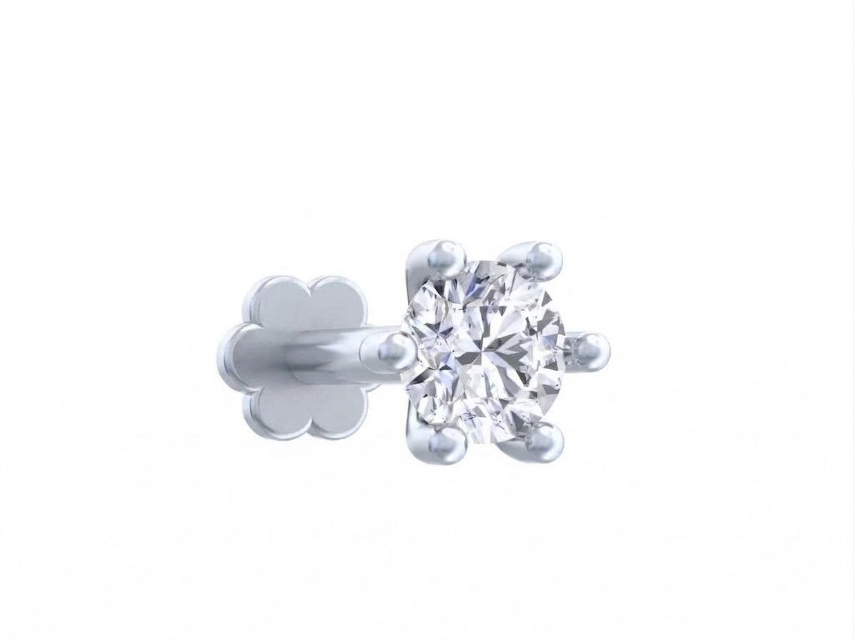 White earring with a clear diamond on a white background