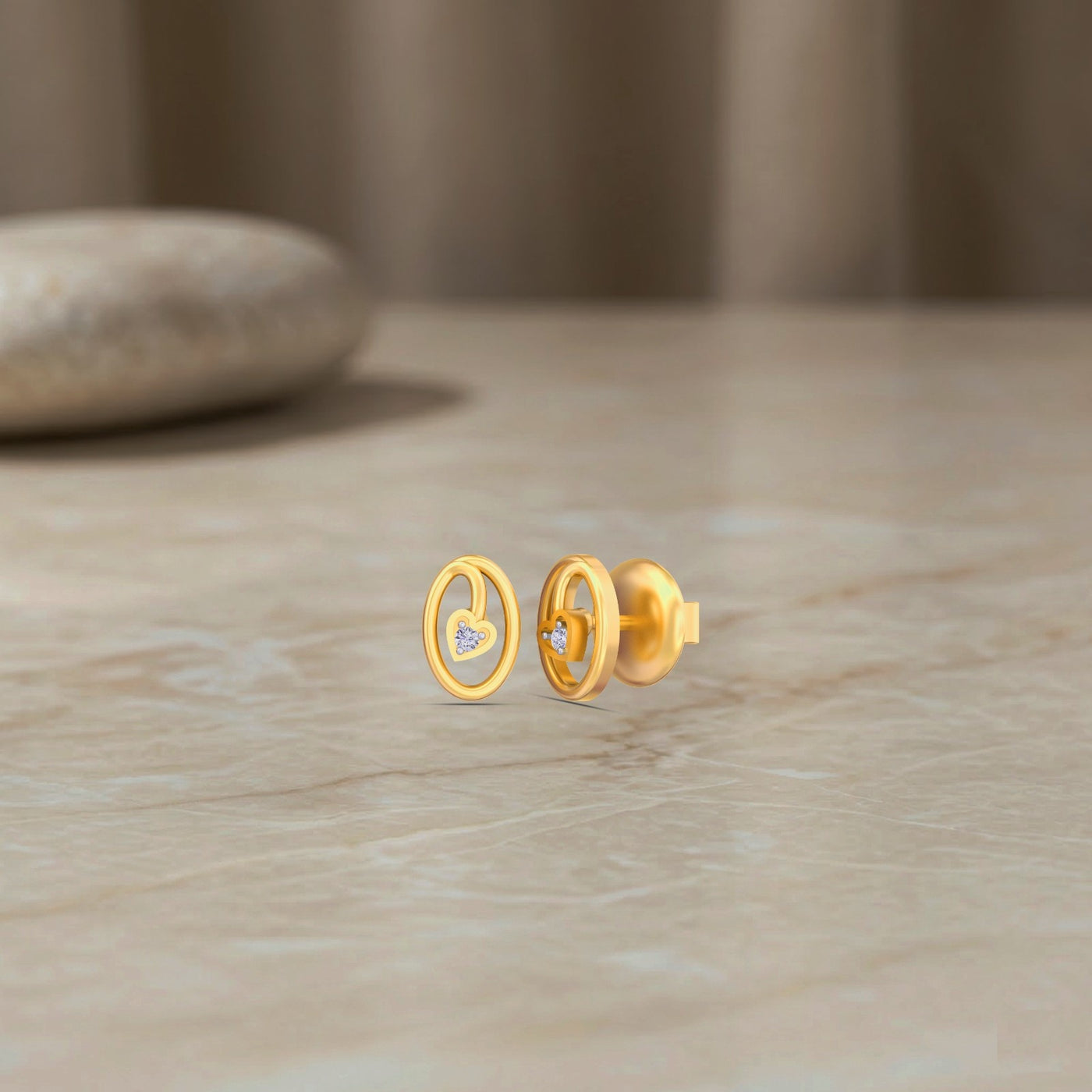 Gold and diamond earrings on a wooden surface