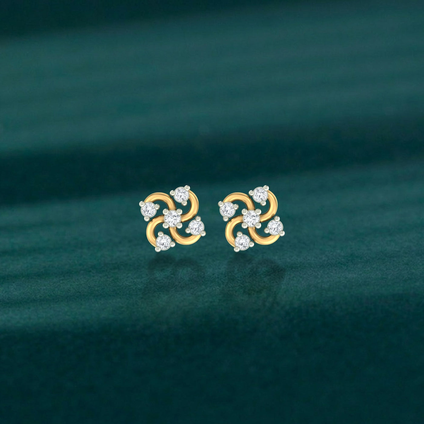 Gold and Diamond floral stud earring on a teal background