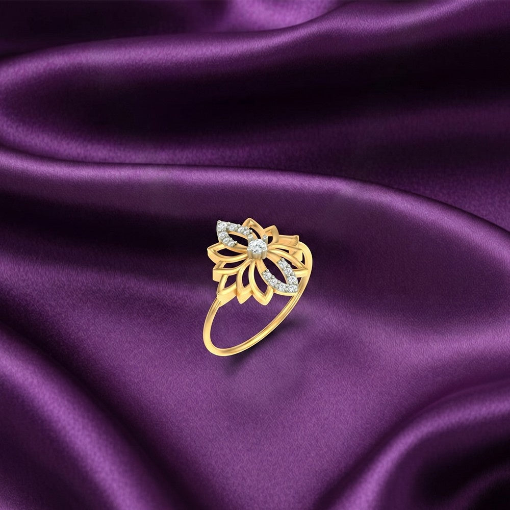 Gold ring with diamonds on a purple satin background