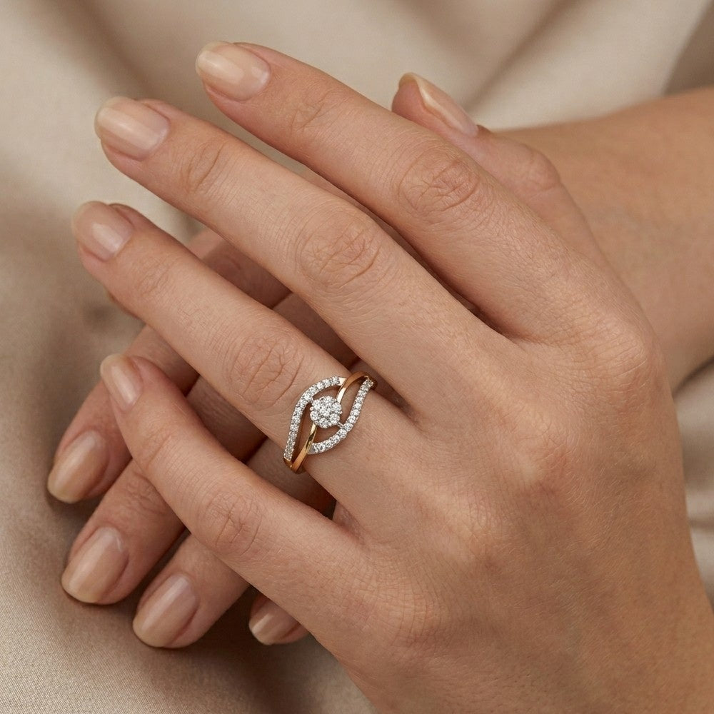 Close-up of a hand wearing a diamond ring on a beige background