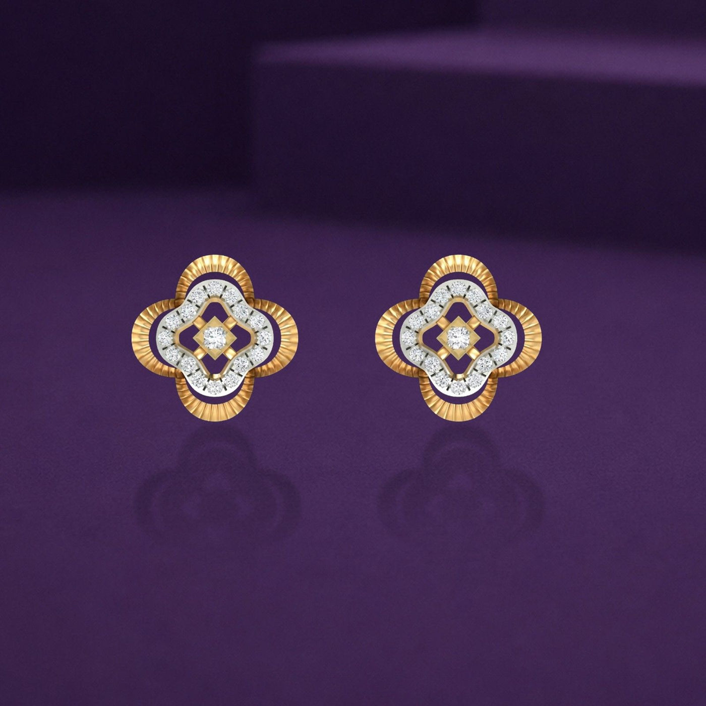Pair of gold and diamond floral-shaped stud earrings on a purple background.
