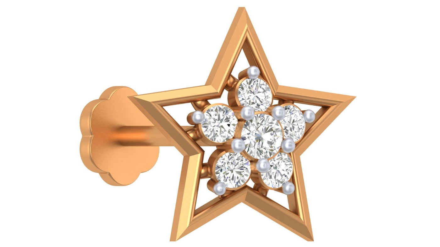 yellow gold and diamond stud nose pin with a central gemstone on a blue white background