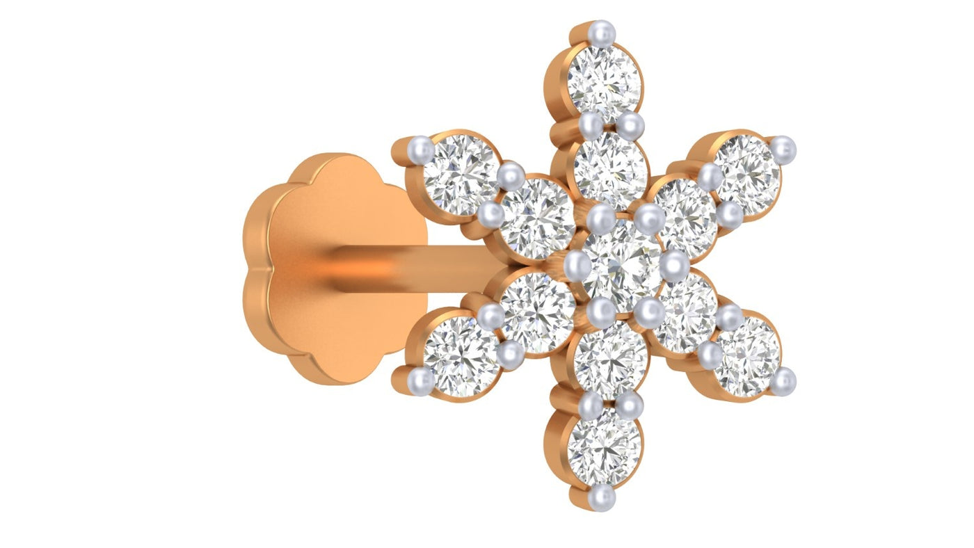 Yellow gold and diamond stud nose pin on a white background