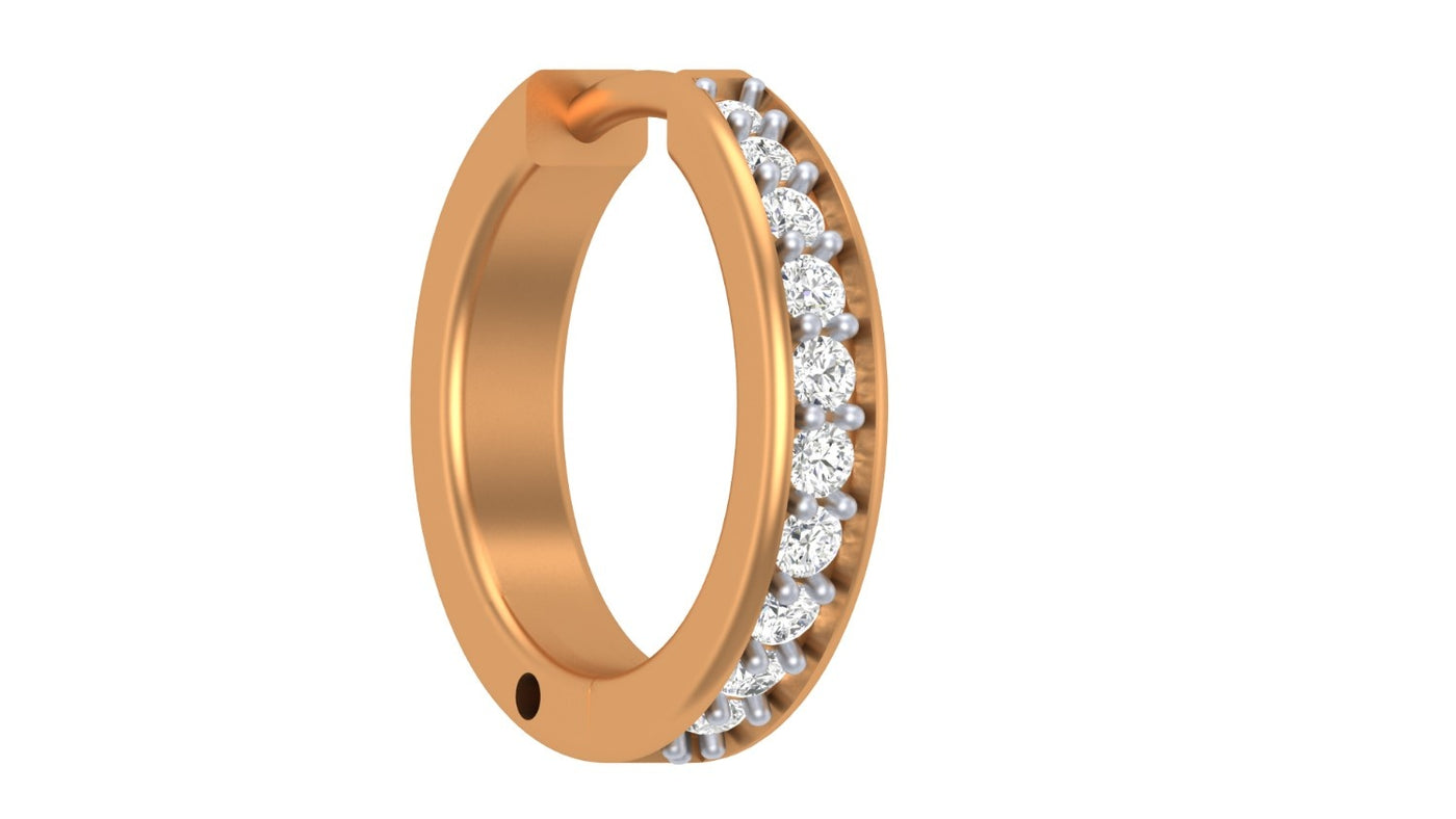 yellow gold and diamond nose ring with embedded stones on a white background