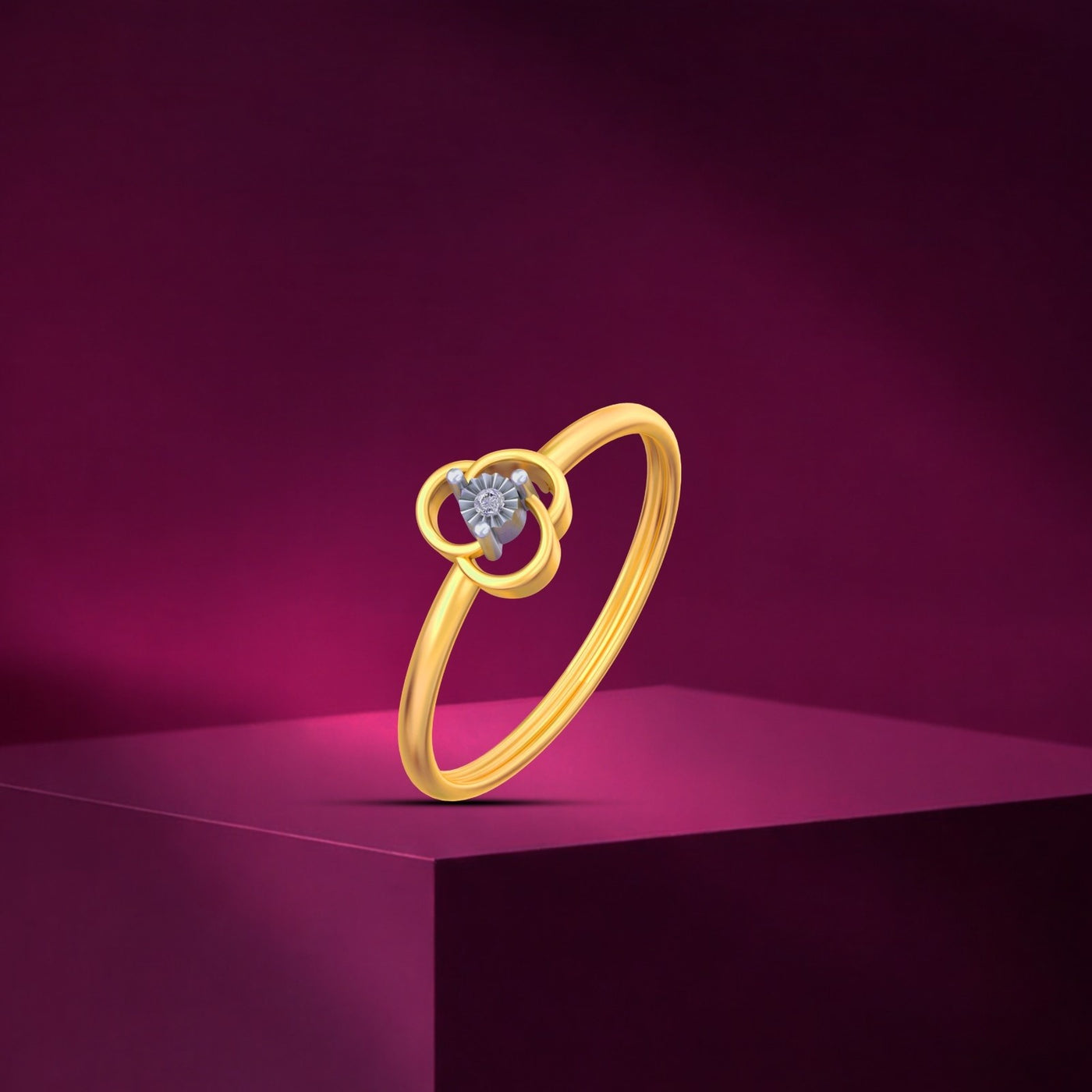 Gold and diamond with floral-design on a pink background.