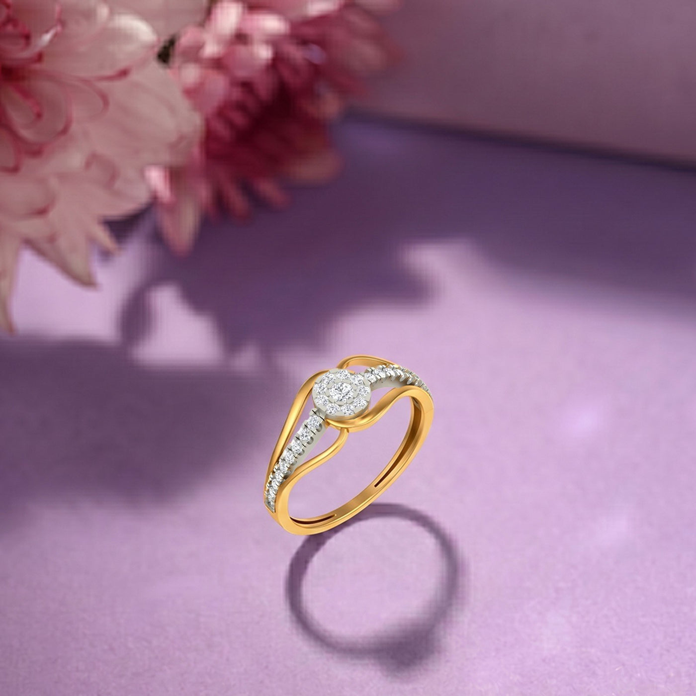 Gold and diamond with cluster setting on a purple surface.