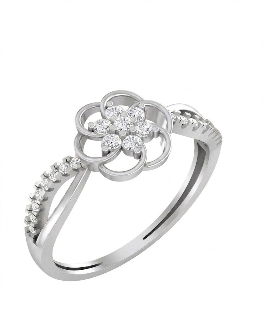 White gold ring with diamond floral design on a white background.