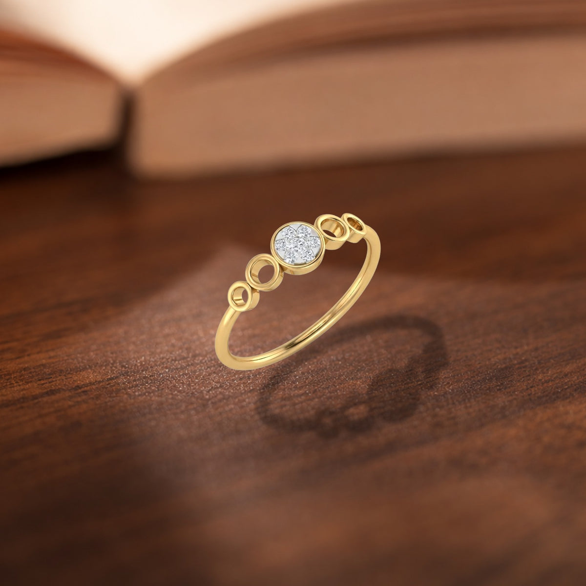 Gold and diamond with cluster setting on a wooden surface.