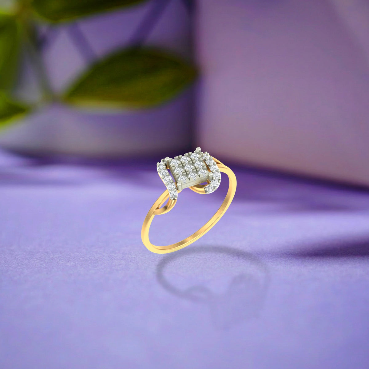 Gold and diamond with cluster ring on a purple  surface.