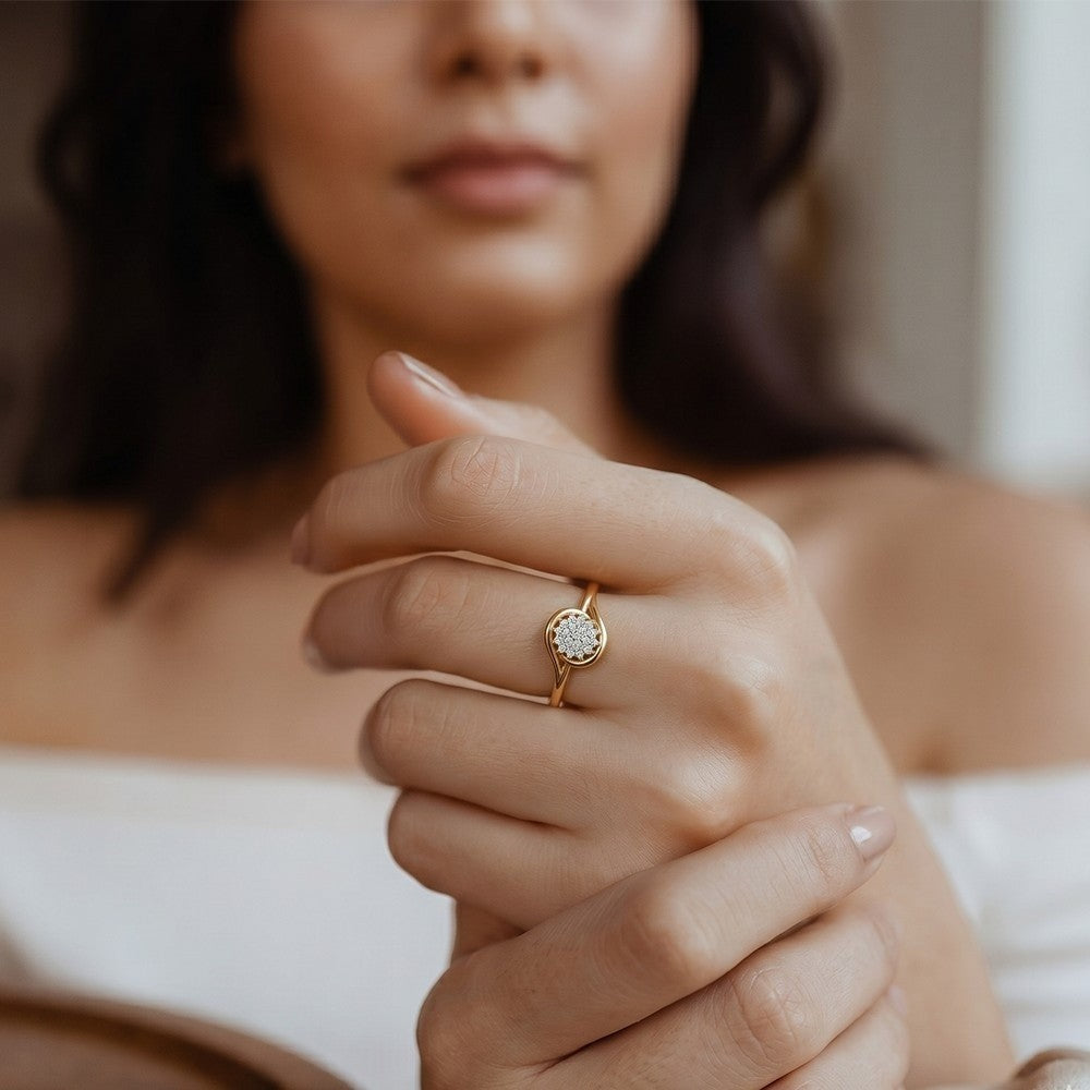 Close-up shot of a gold and diamond with floral design ring.