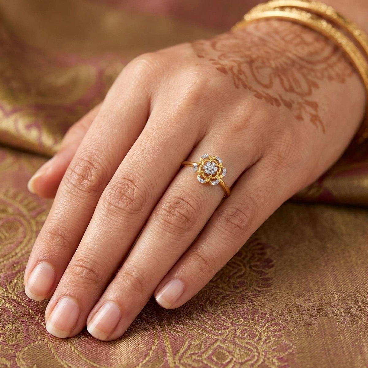 Gold and diamond with floral design on a golden surface.
