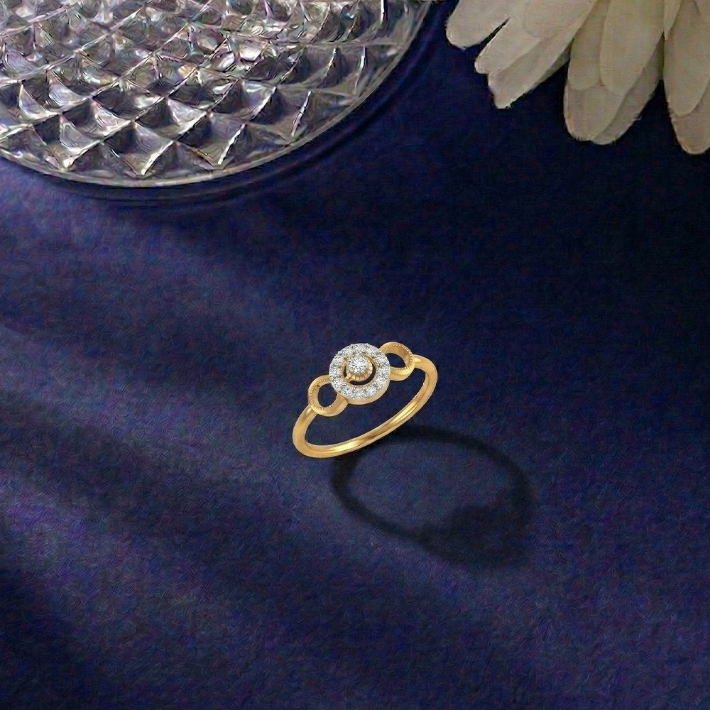 Gold and diamond with halo diamond setting on a blue surface.