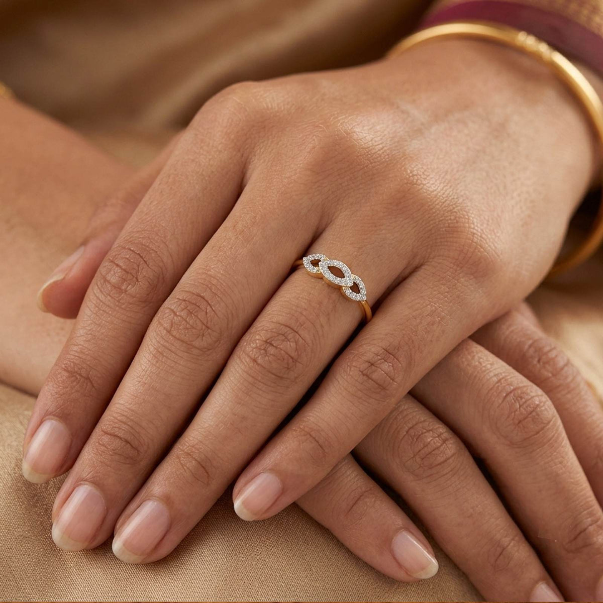 Close-up shot of a gold and diamond women's ring.