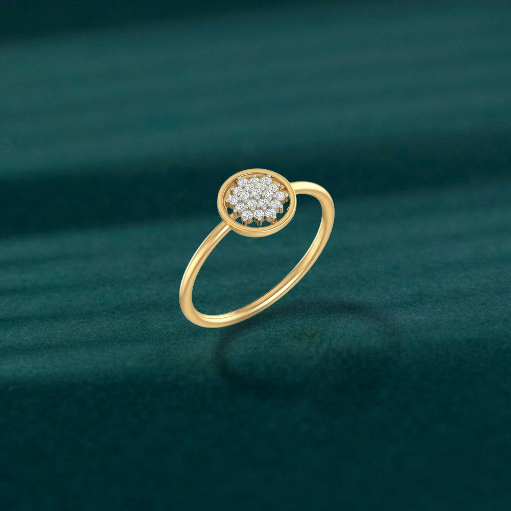 Gold and diamond with round-shaped and center floral cluster setting on a teal surface.