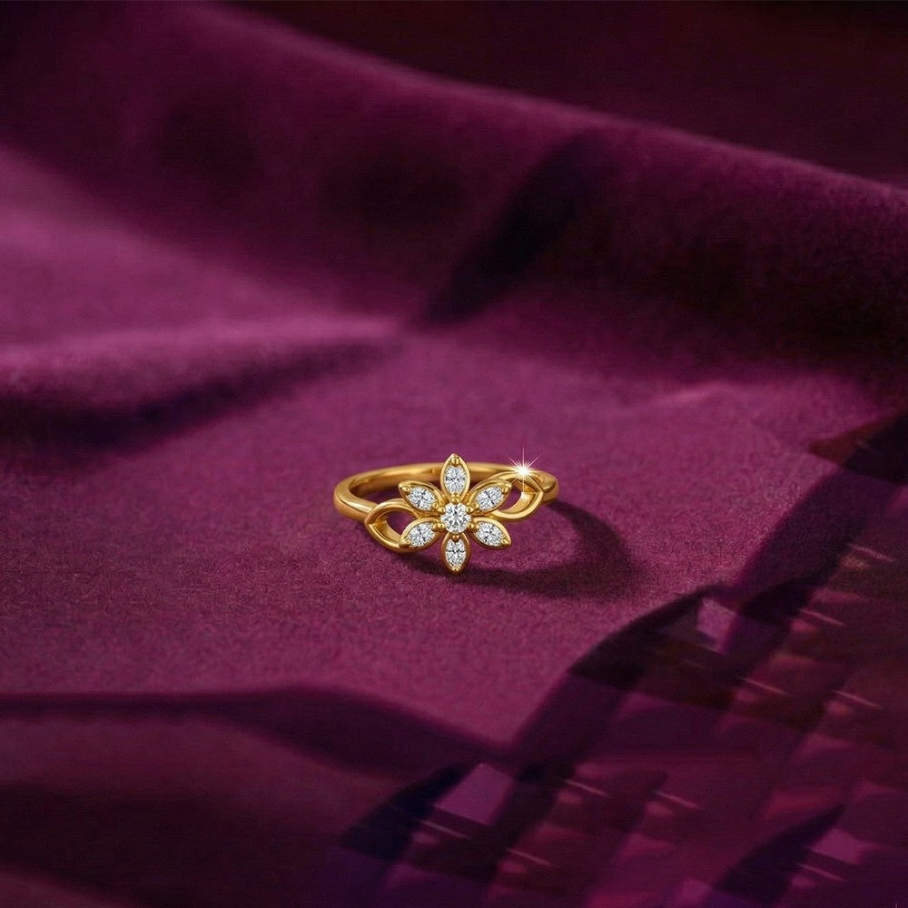 Gold ring with diamonds on a purple fabric background