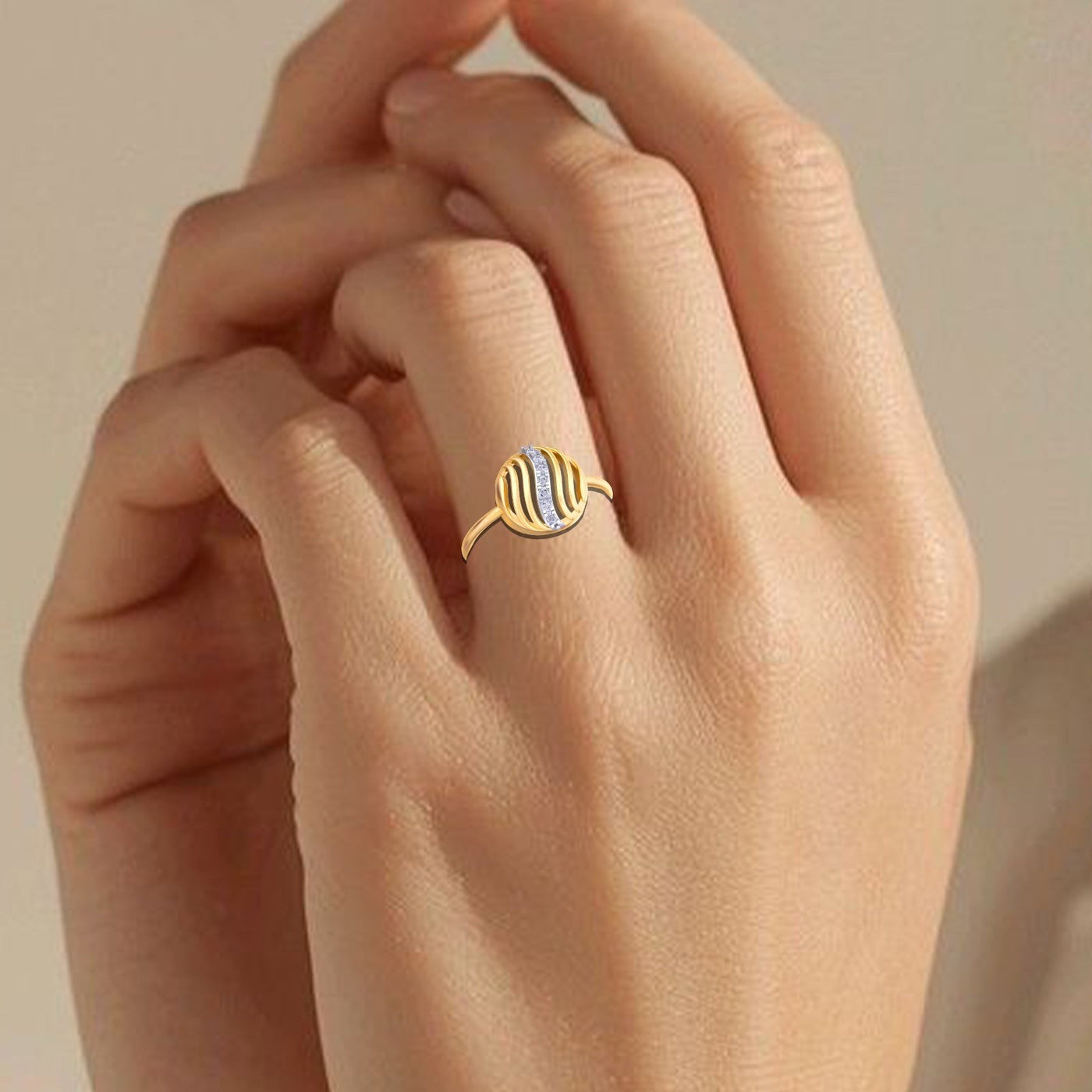 Close-up shot of a gold and diamond with circular setting ring.