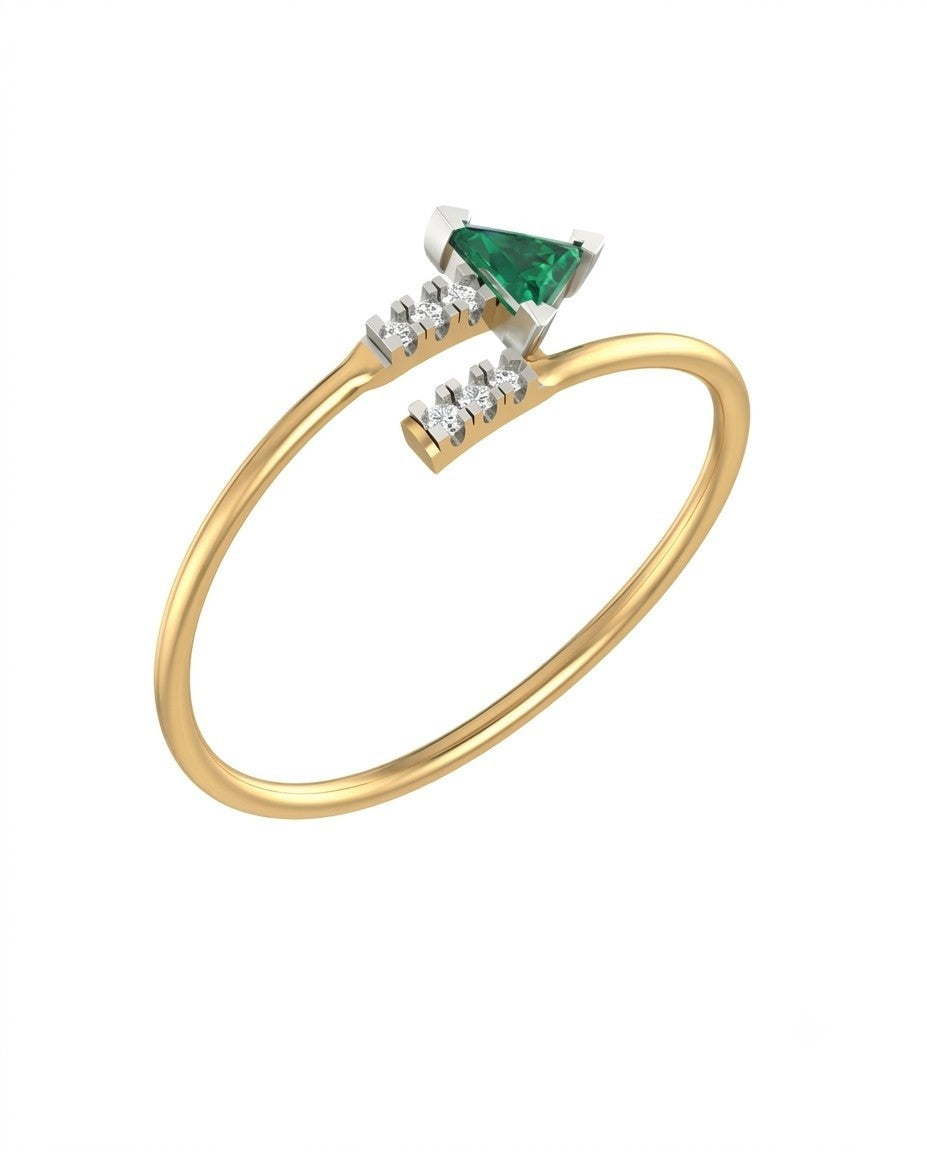 Yellow gold ring with a emerald gemstone and diamonds on a white background