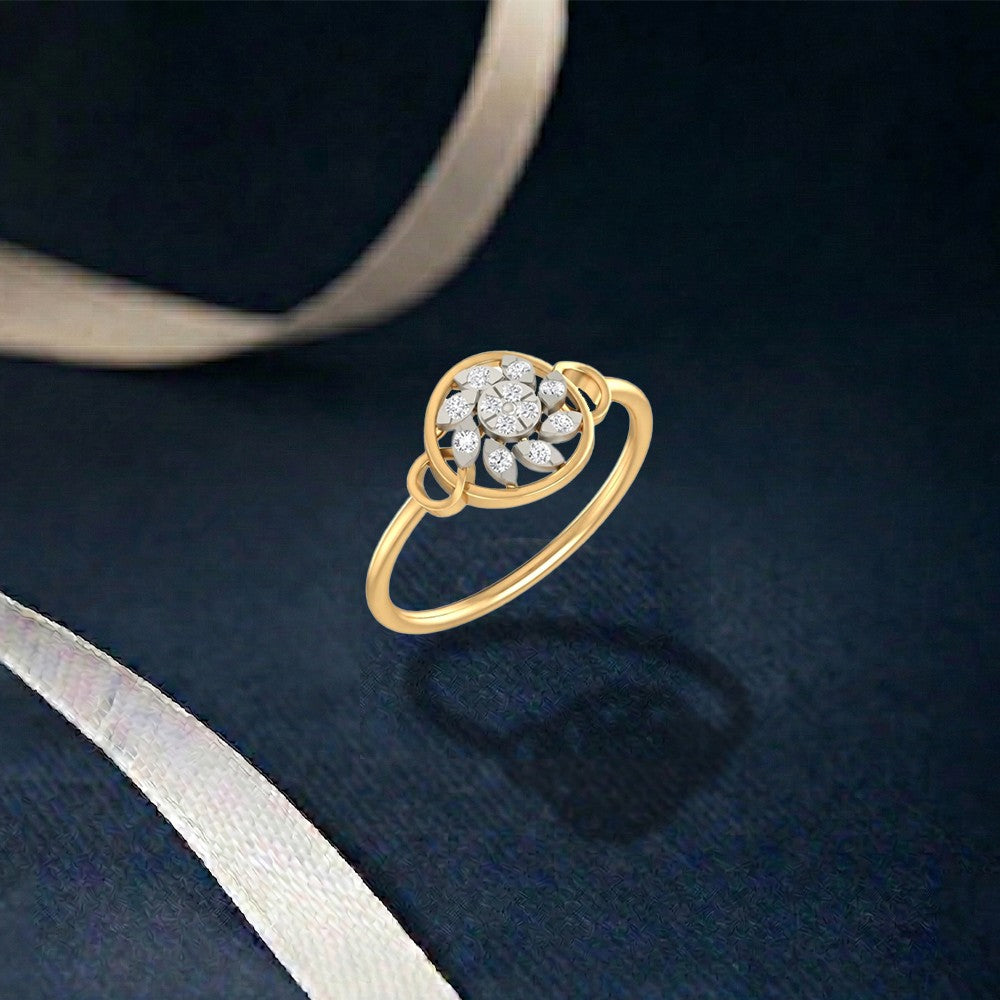 Gold and diamond with cluster setting on a navy blue surface.