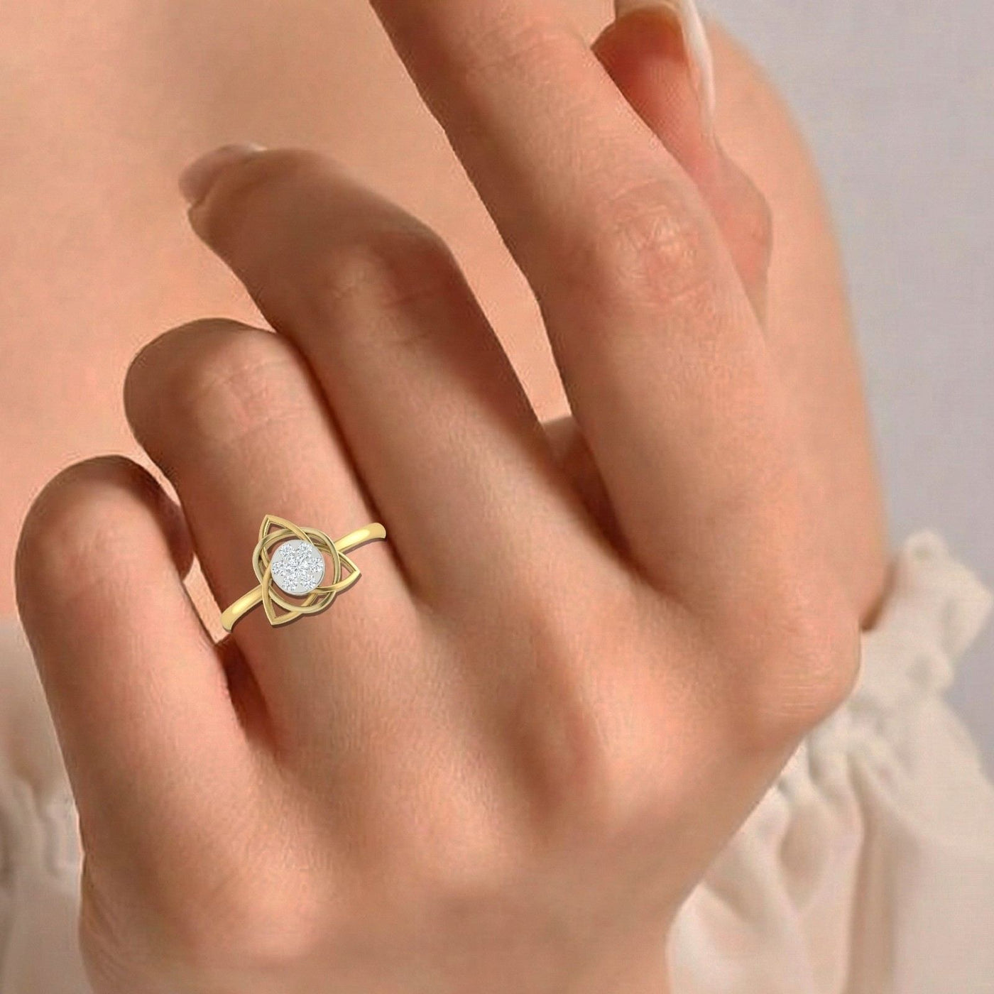 Close-up shot of a gold and diamond with cluster setting women's ring.