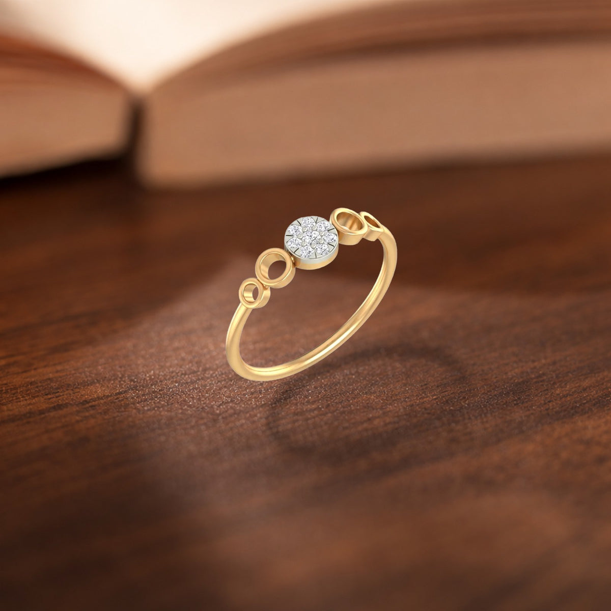 Gold and diamond with cluster setting on a wooden surface.